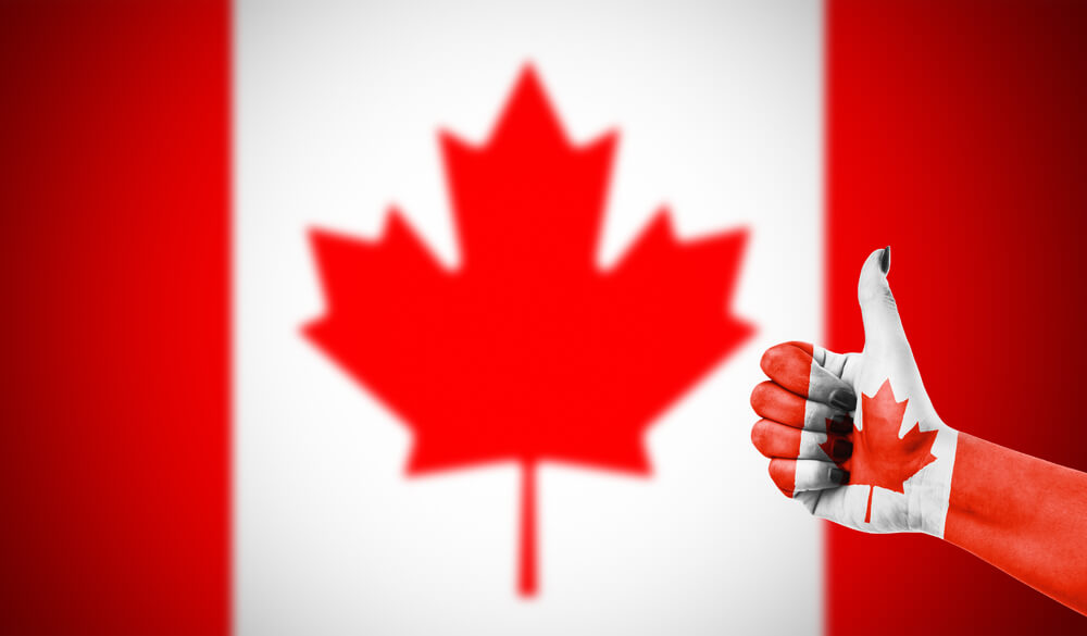 Kanadensisk-flagga-med-tumme
